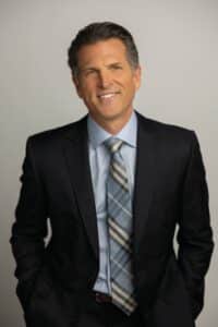 Justin West, MD, FACS, board-certified plastic surgeon and owner of Finesse Plastic Surgery